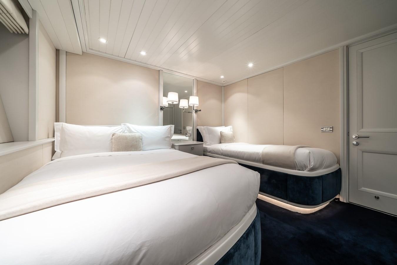 a room with two beds aboard MOATIZE Yacht for Sale