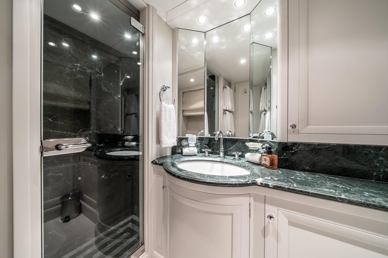 a bathroom with a large mirror aboard MOATIZE Yacht for Sale