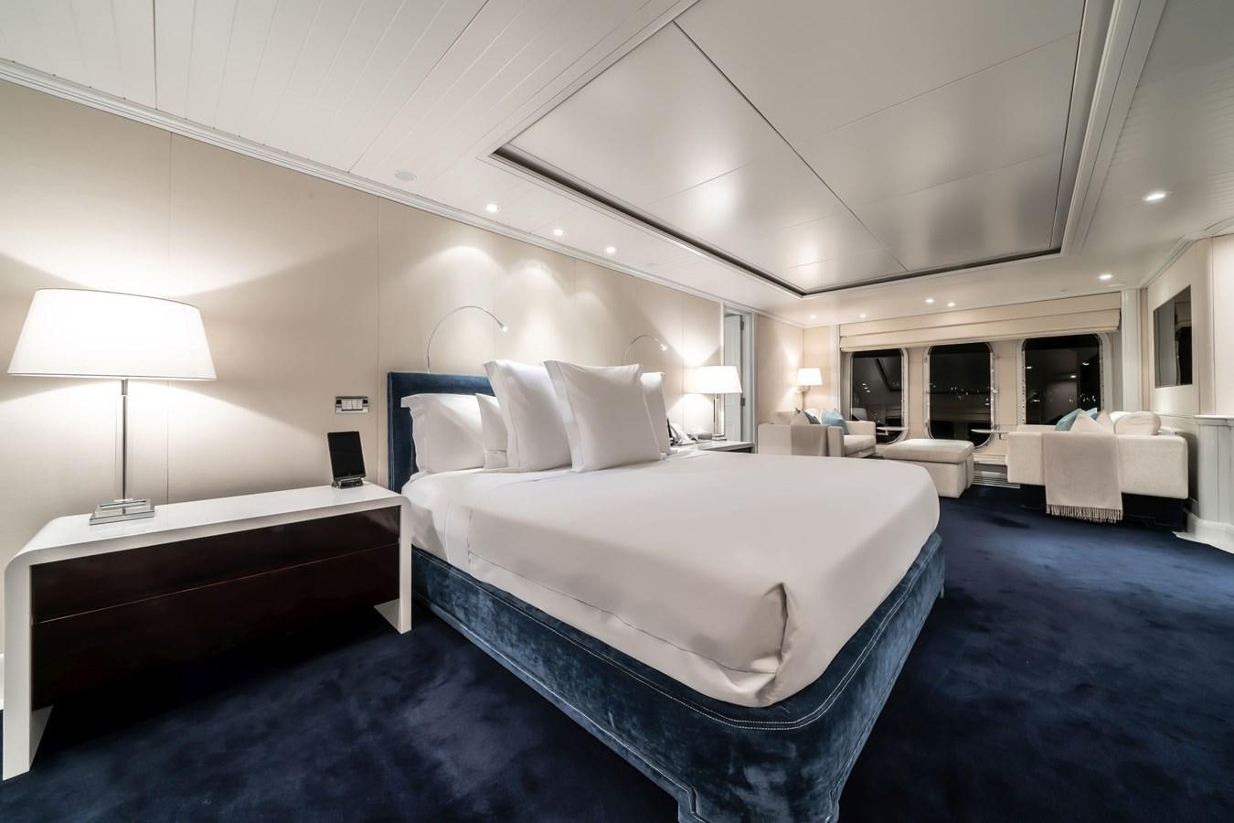 a room with a bed and a chair aboard MOATIZE Yacht for Sale