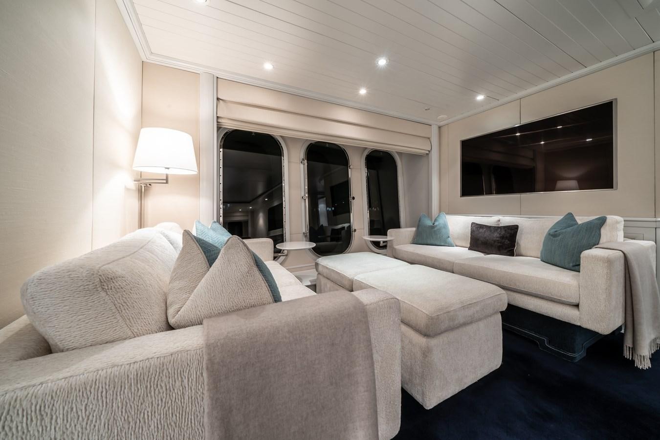 a room with a couch and a television aboard MOATIZE Yacht for Sale