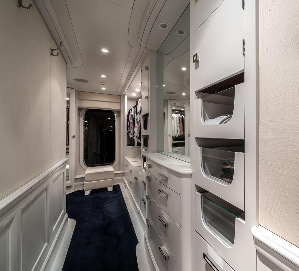 a long hallway with white cabinets aboard MOATIZE Yacht for Sale