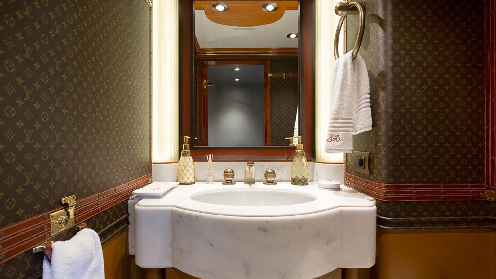 a bathroom with a sink and mirror aboard IL SOLE Yacht for Charter