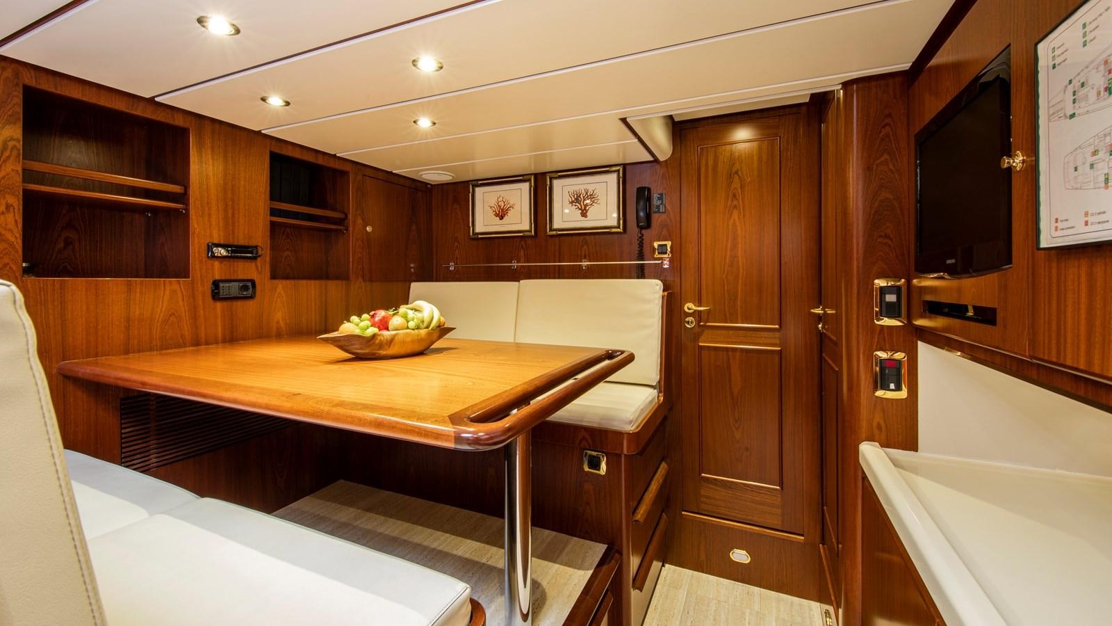a kitchen with a table and cabinets aboard SOUTHWIND OF Yacht for Sale
