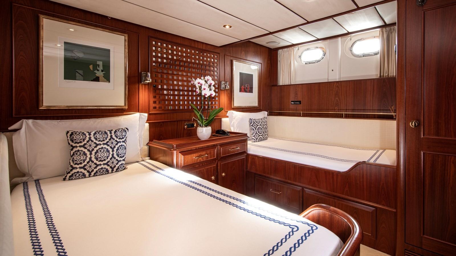 a room with a bed and a mirror aboard SOUTHWIND OF Yacht for Sale