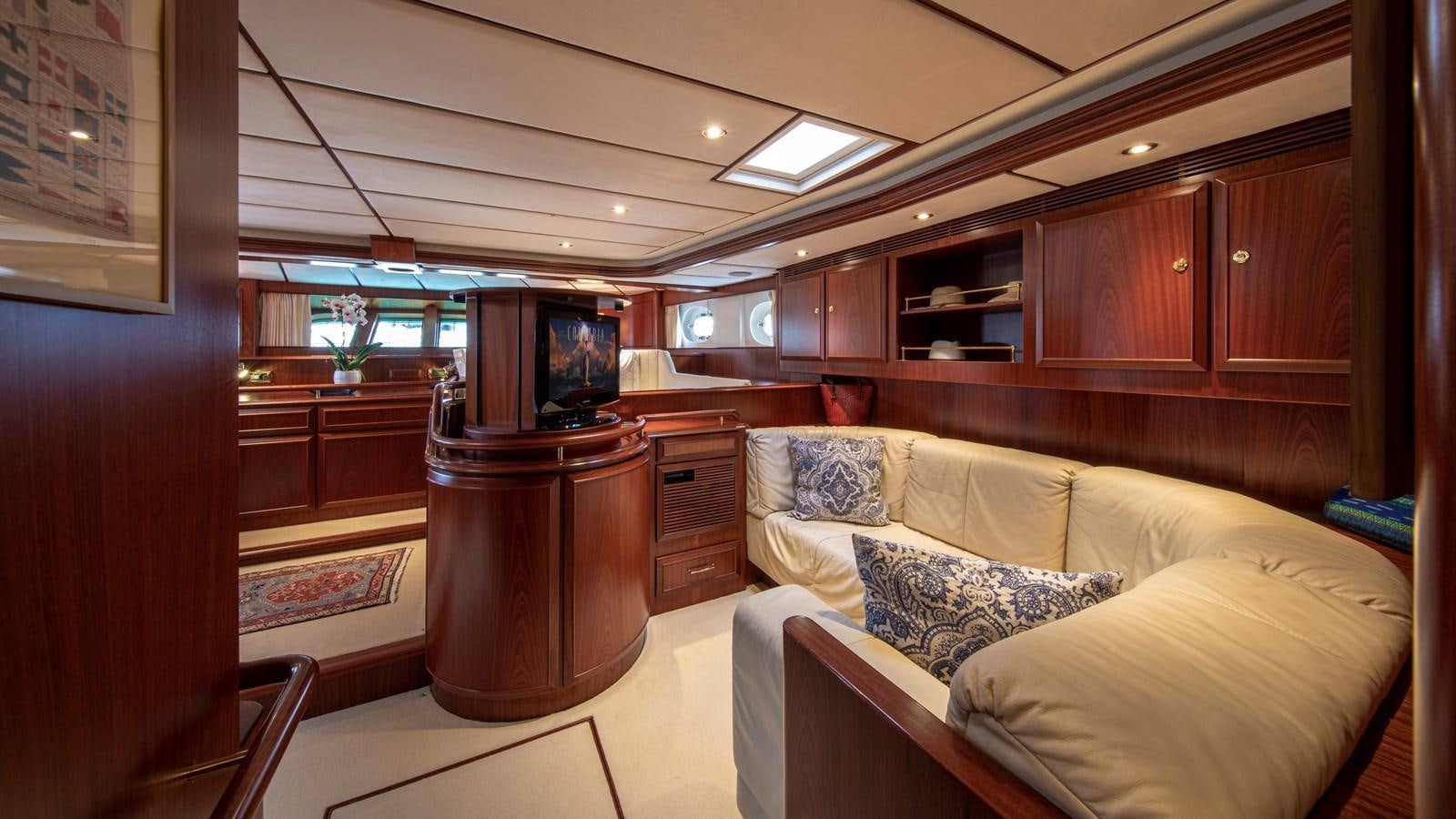 a living room with a couch and a tv aboard SOUTHWIND OF Yacht for Sale