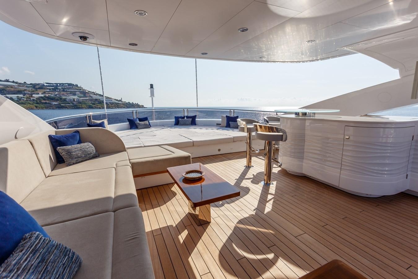 a room with a table and couches aboard NO.9 Yacht for Charter