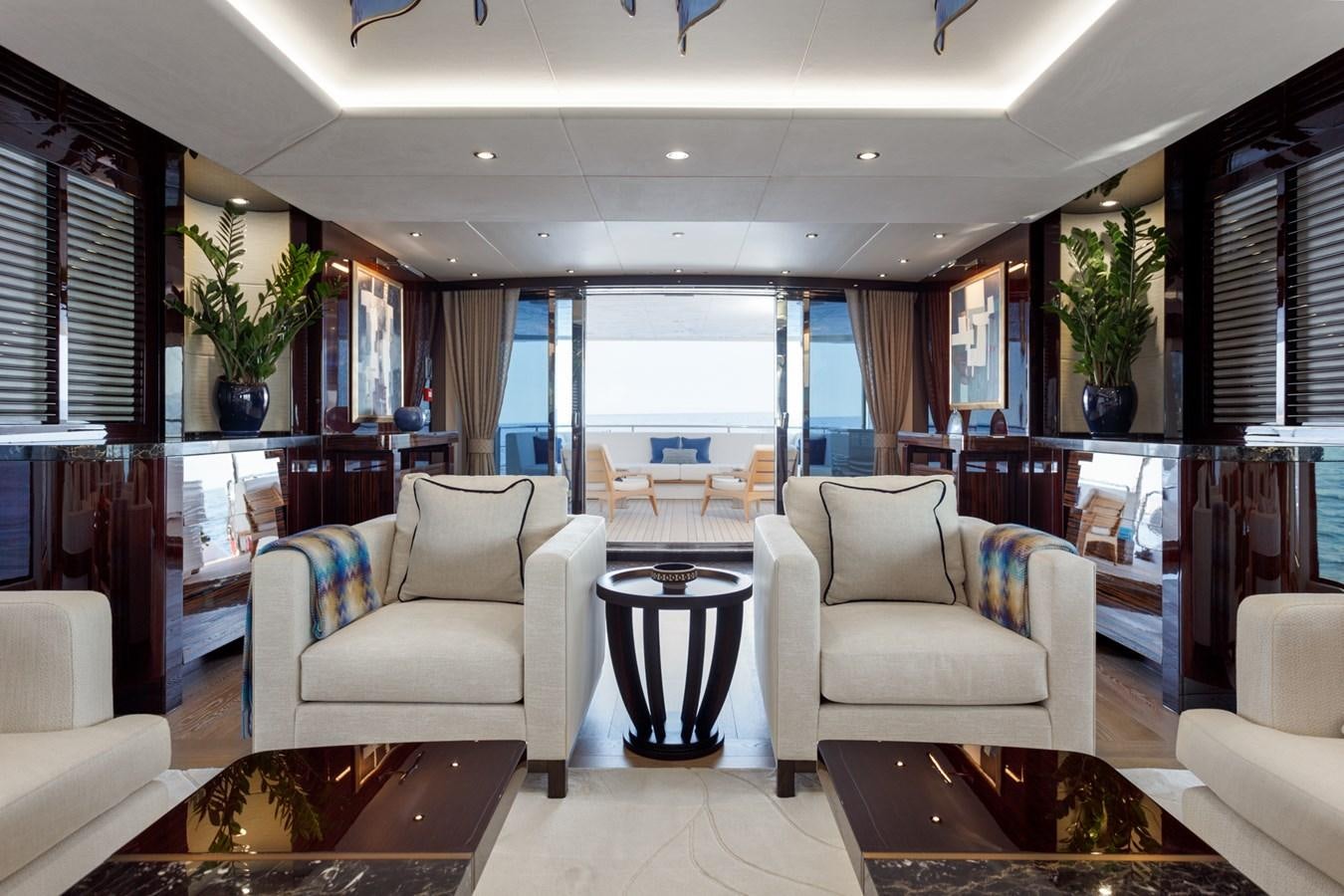 a living room with a large window aboard NO.9 Yacht for Charter