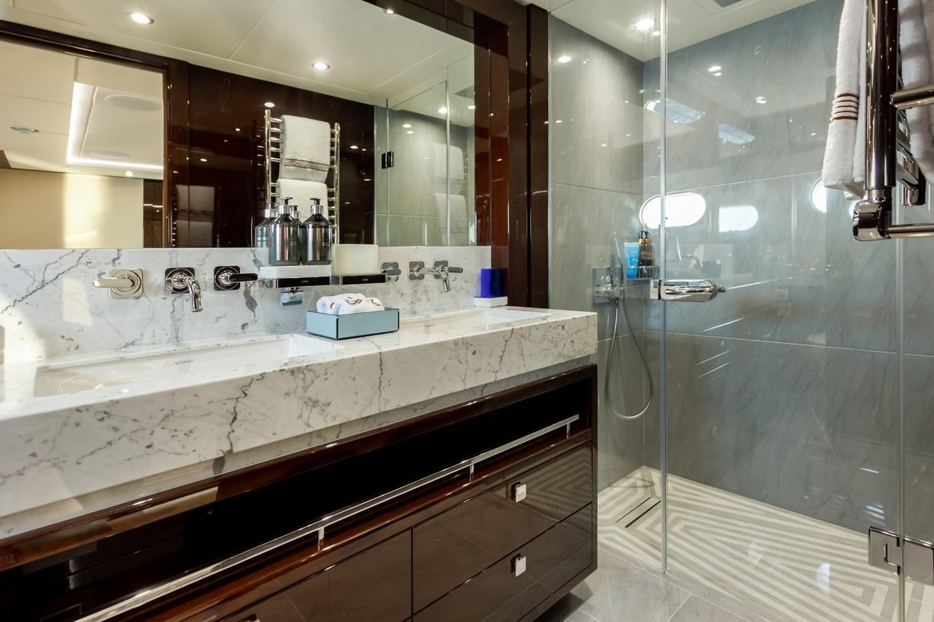 a bathroom with a glass shower aboard NO.9 Yacht for Charter