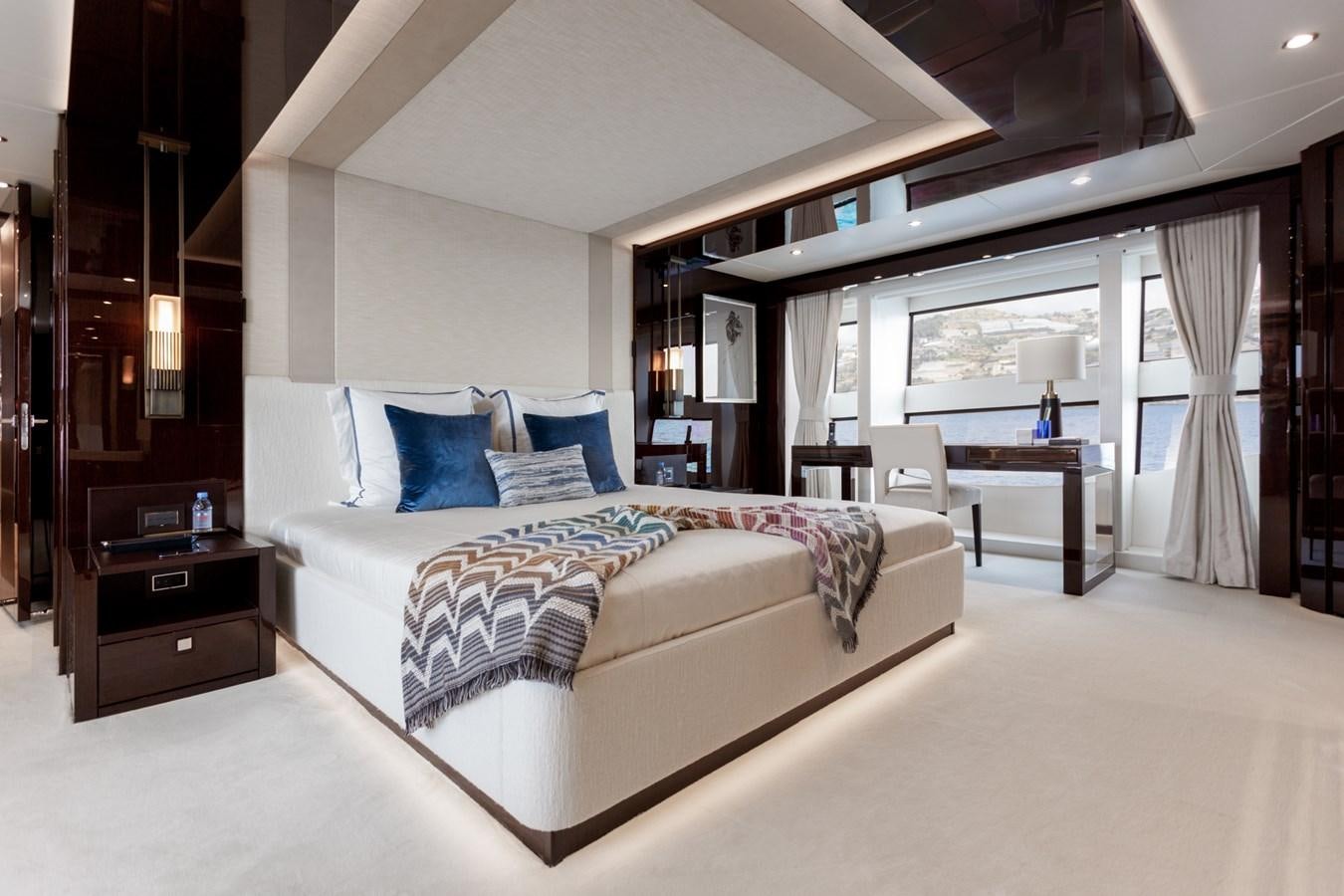a large bedroom with a bed aboard NO.9 Yacht for Charter