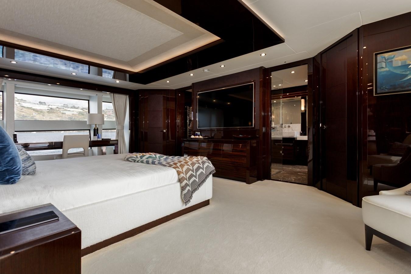 a room with a bed and a desk aboard NO.9 Yacht for Charter