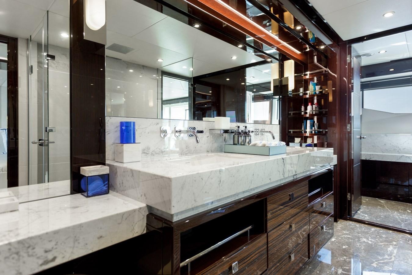 a bathroom with a large mirror aboard NO.9 Yacht for Charter