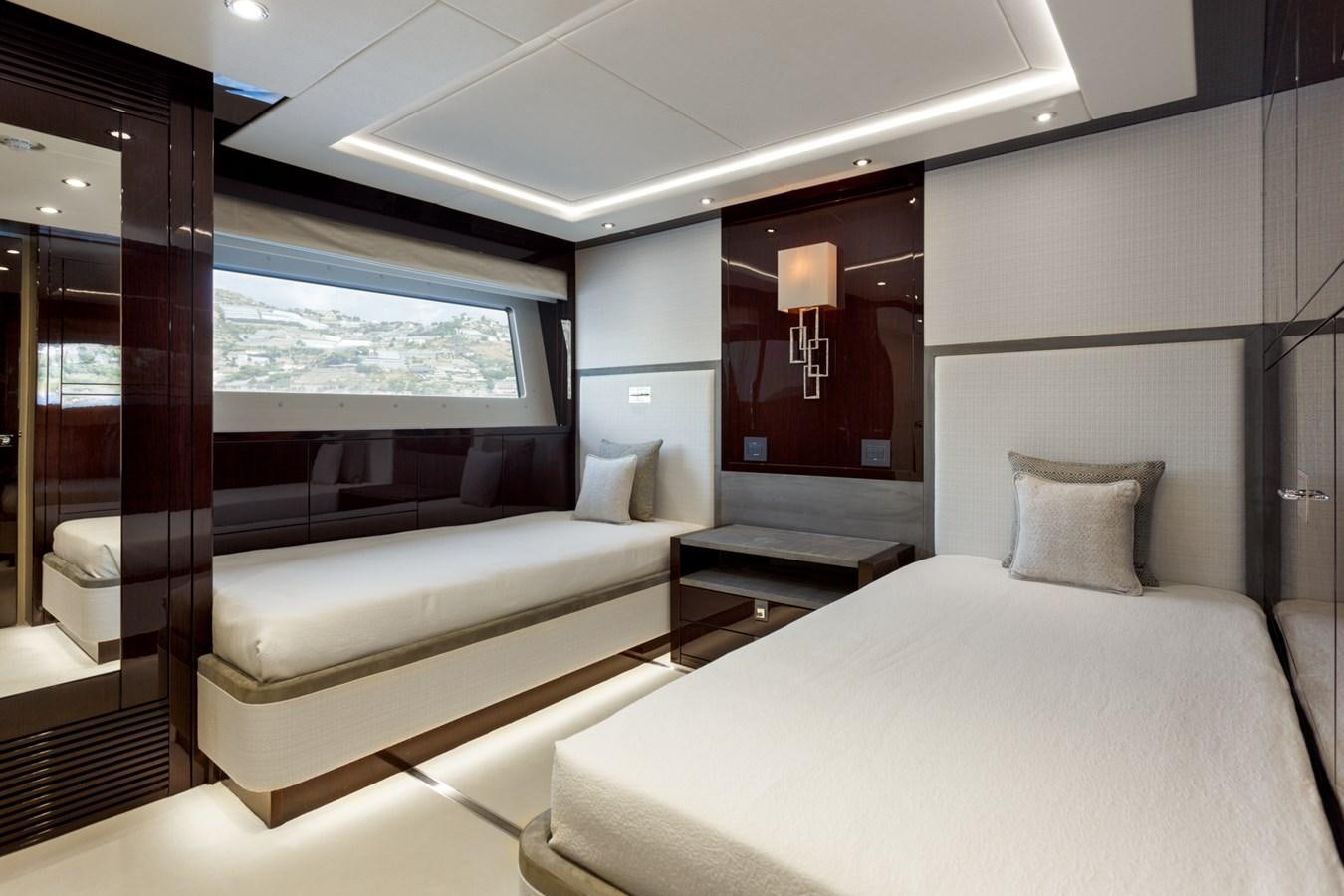 a room with a bed and a window aboard NO.9 Yacht for Charter