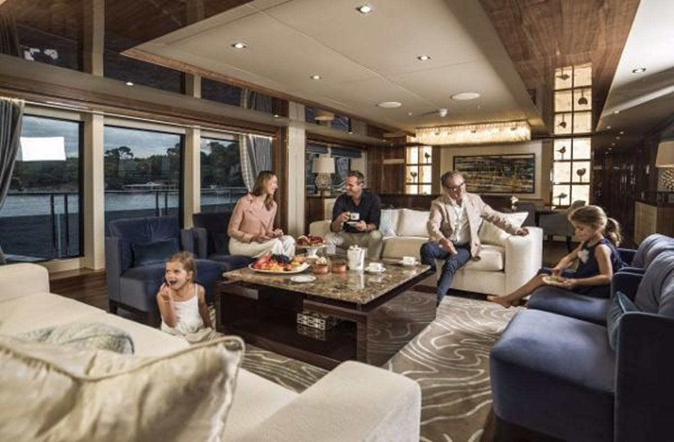 a group of people in a living room aboard 131 YACHT Yacht for Sale