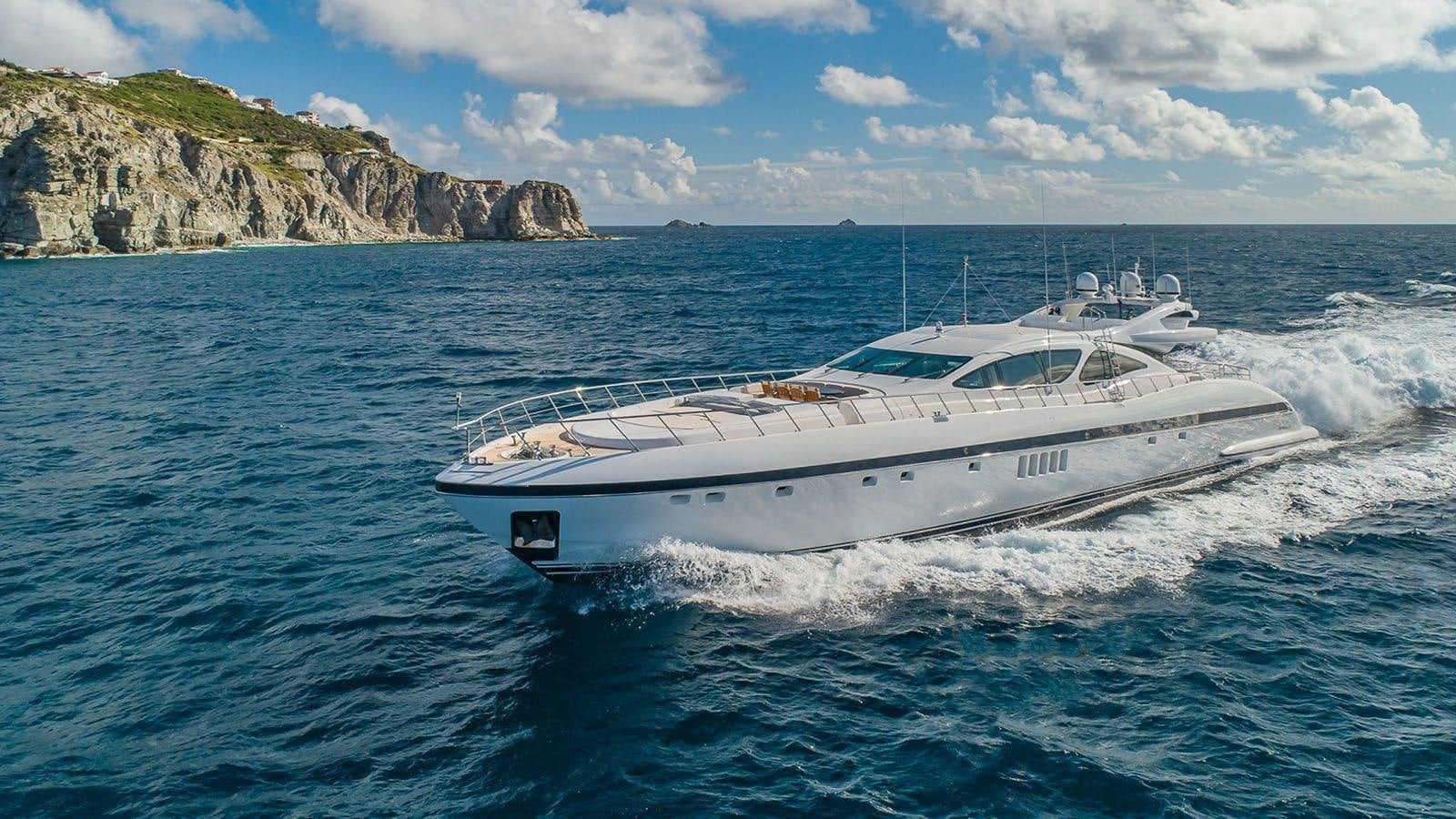 a white boat on the water aboard JOMAR Yacht for Sale