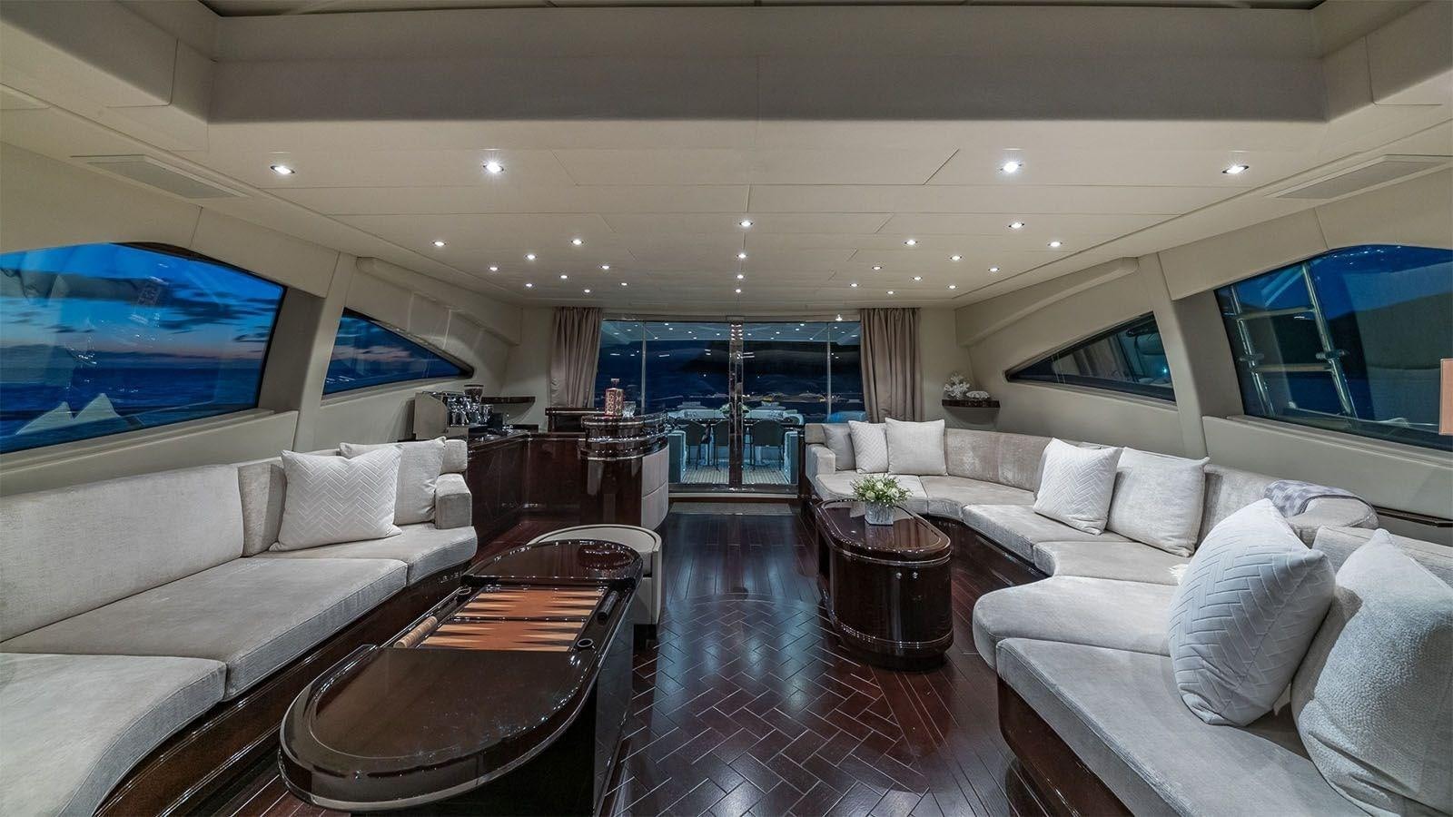 a living room with a large screen aboard JOMAR Yacht for Sale