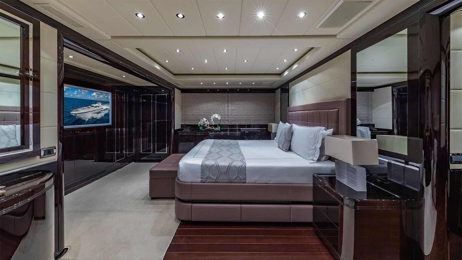 a room with a bed and a tv aboard JOMAR Yacht for Sale