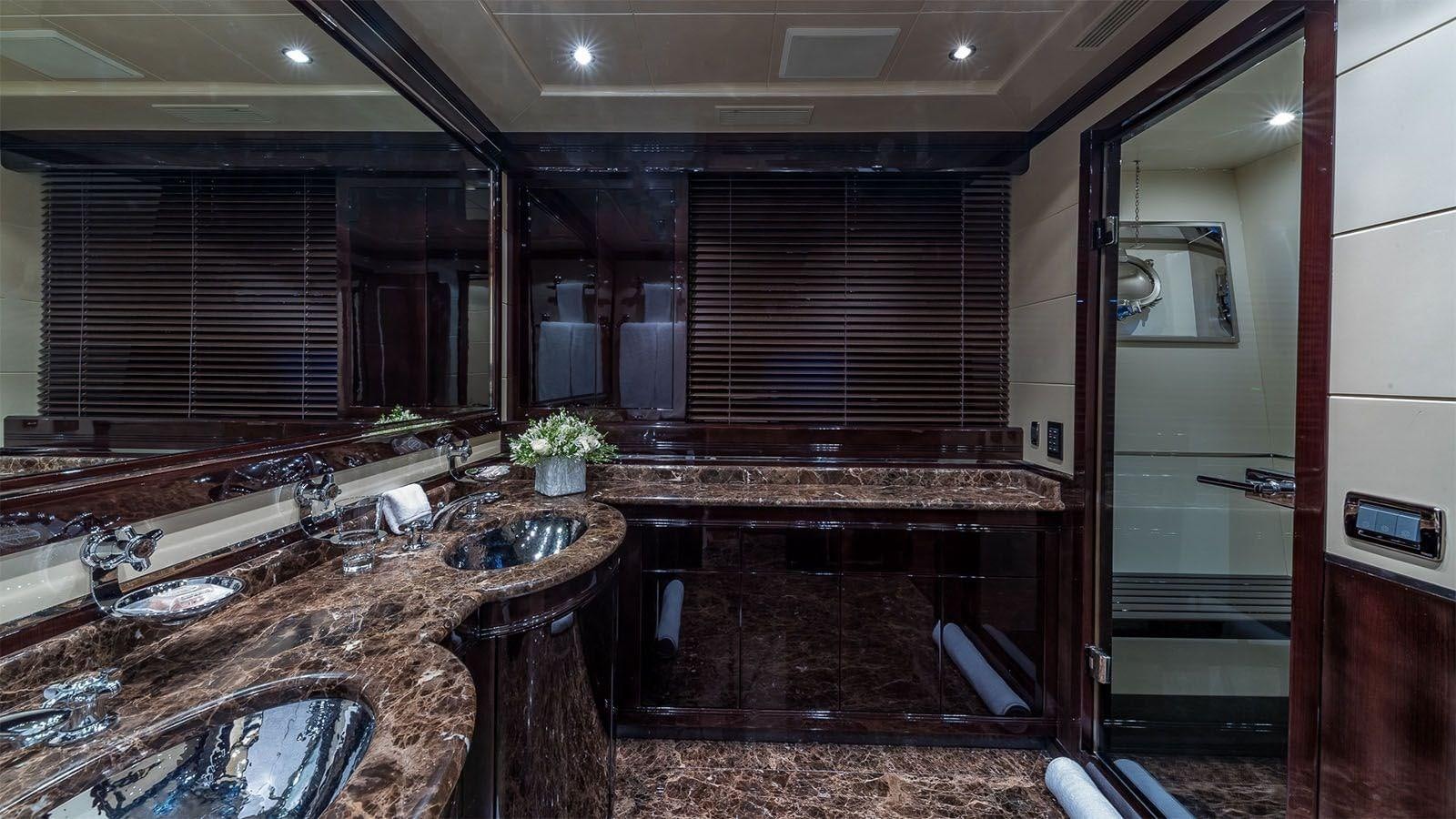 a large bathroom with a large countertop aboard JOMAR Yacht for Sale