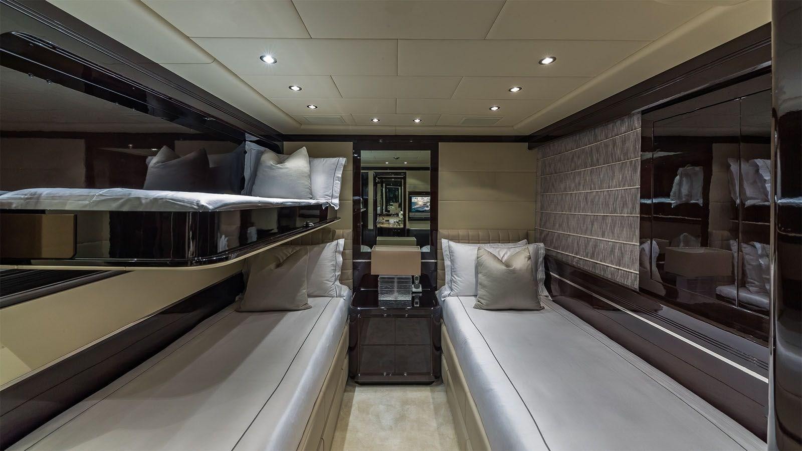 a room with a bed and a mirror aboard JOMAR Yacht for Sale