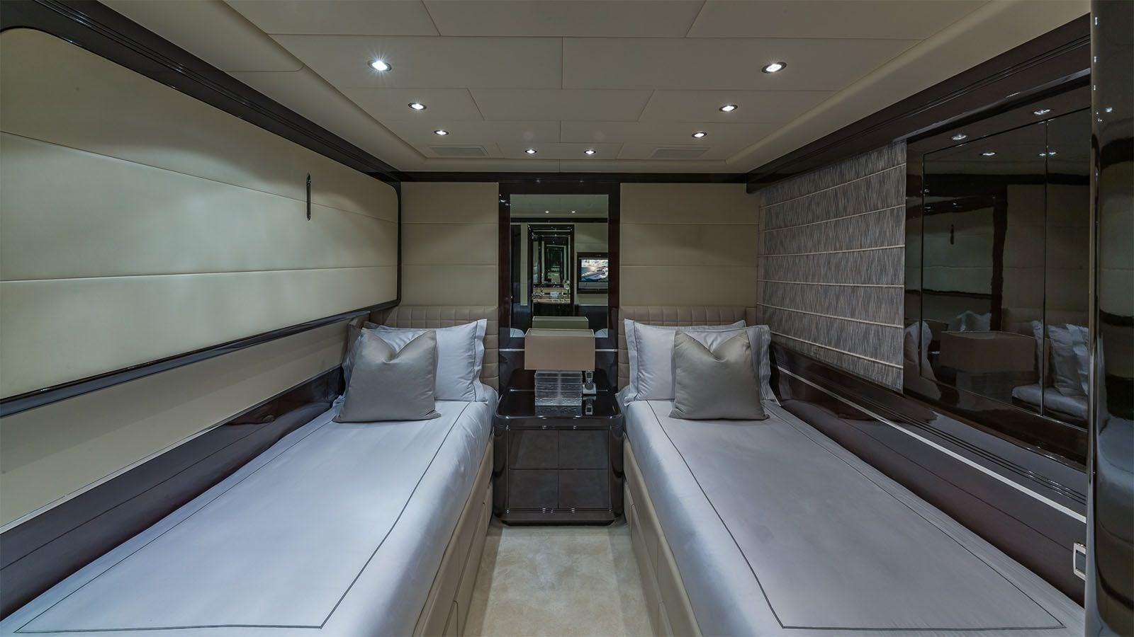 a room with a bed and a mirror aboard JOMAR Yacht for Sale