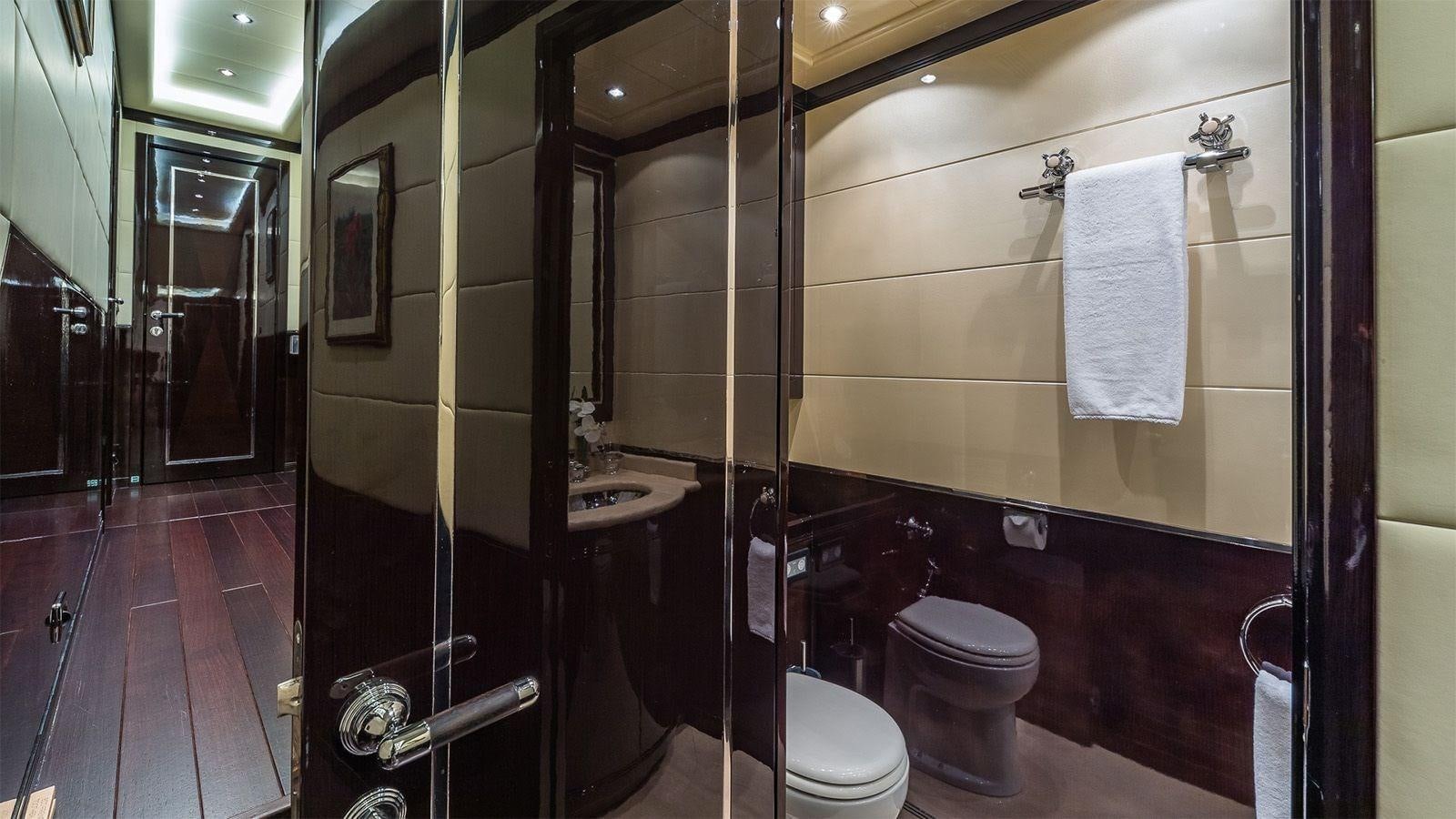 a bathroom with a glass shower aboard JOMAR Yacht for Sale