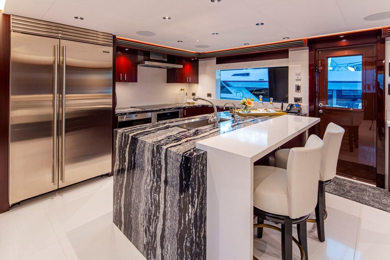 a kitchen with stainless steel appliances aboard LION'S DEN Yacht for Sale