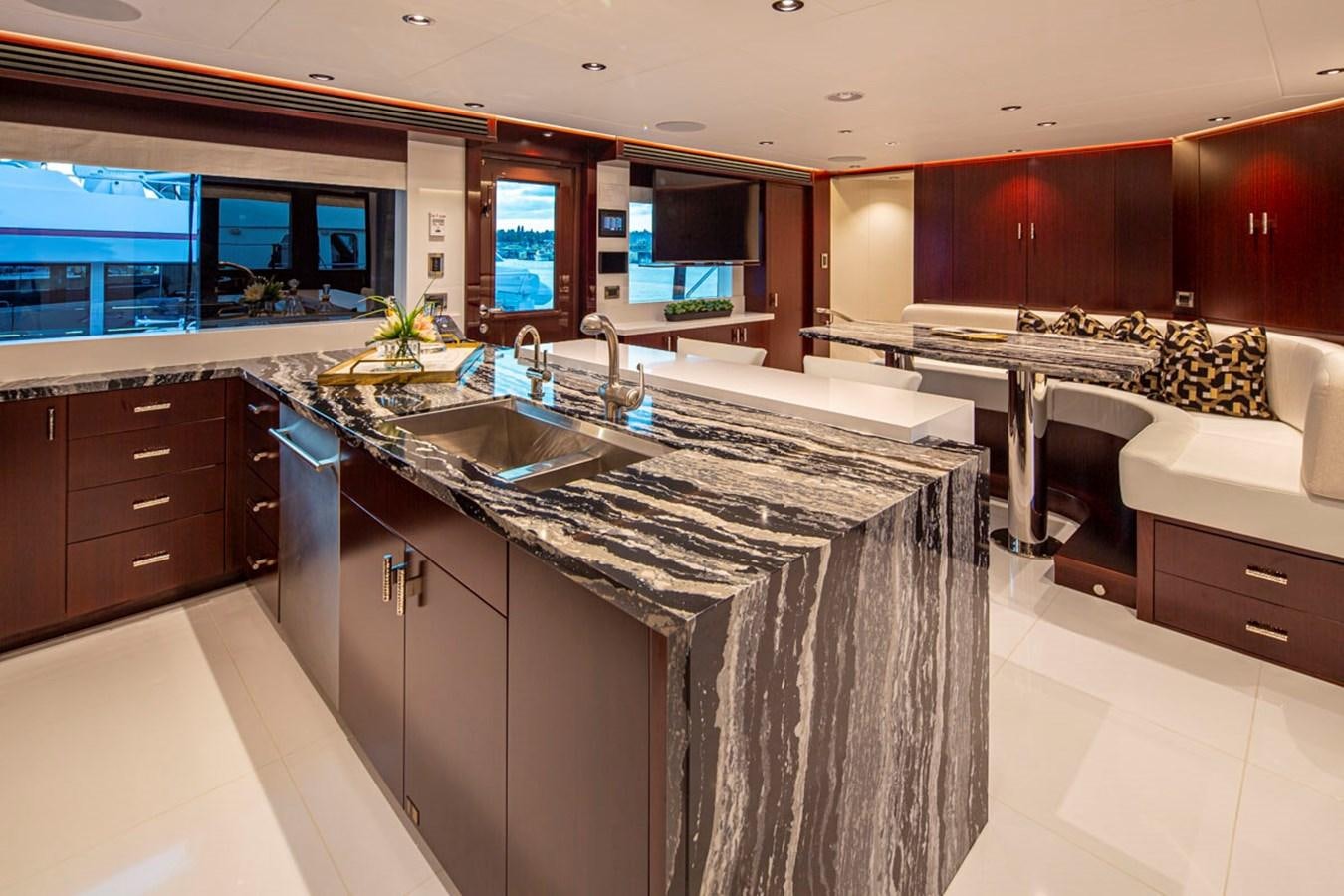 a kitchen with a countertop sink aboard LION'S DEN Yacht for Sale