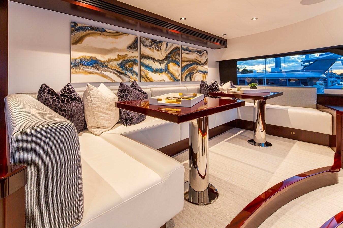 a room with a couch and a table and a tv aboard LION'S DEN Yacht for Sale