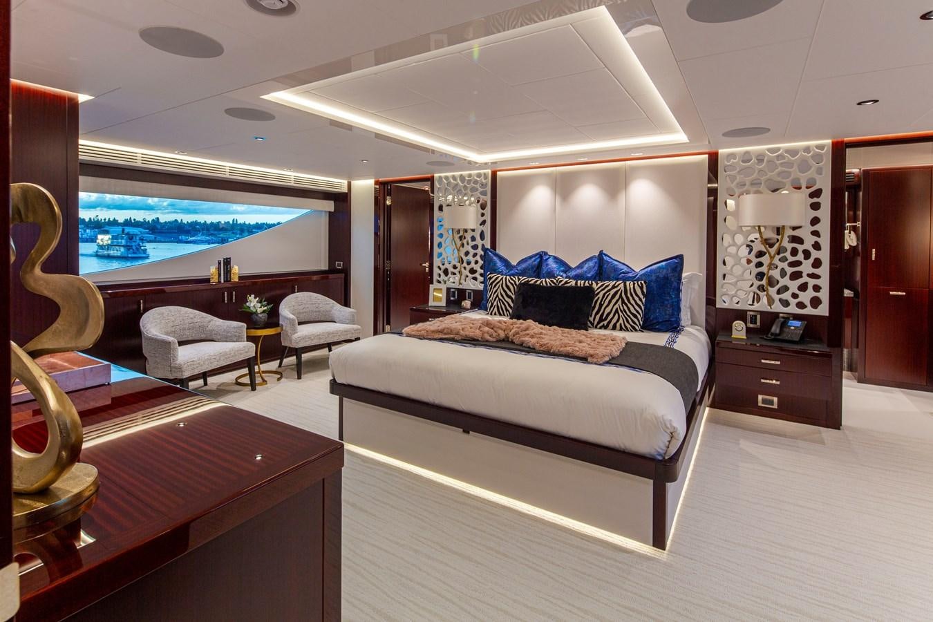 a bedroom with a large bed aboard LION'S DEN Yacht for Sale