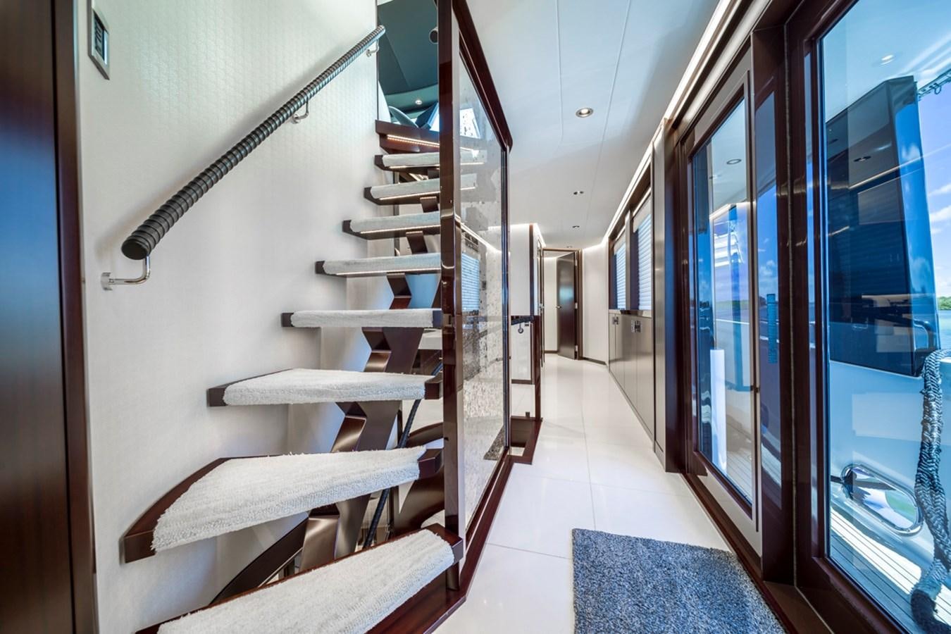 a staircase in a building aboard LION'S DEN Yacht for Sale