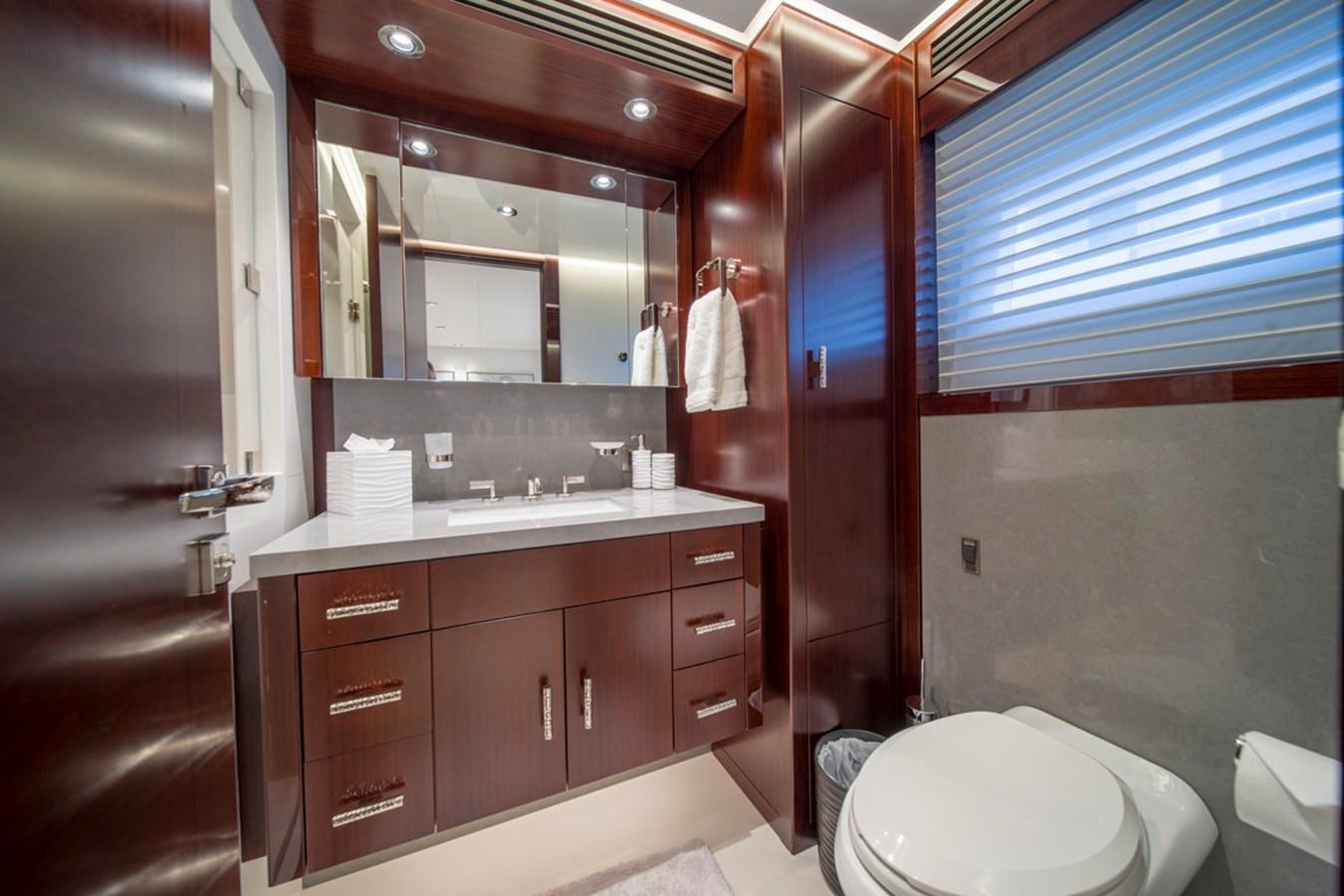 a bathroom with a sink and a toilet aboard LION'S DEN Yacht for Sale