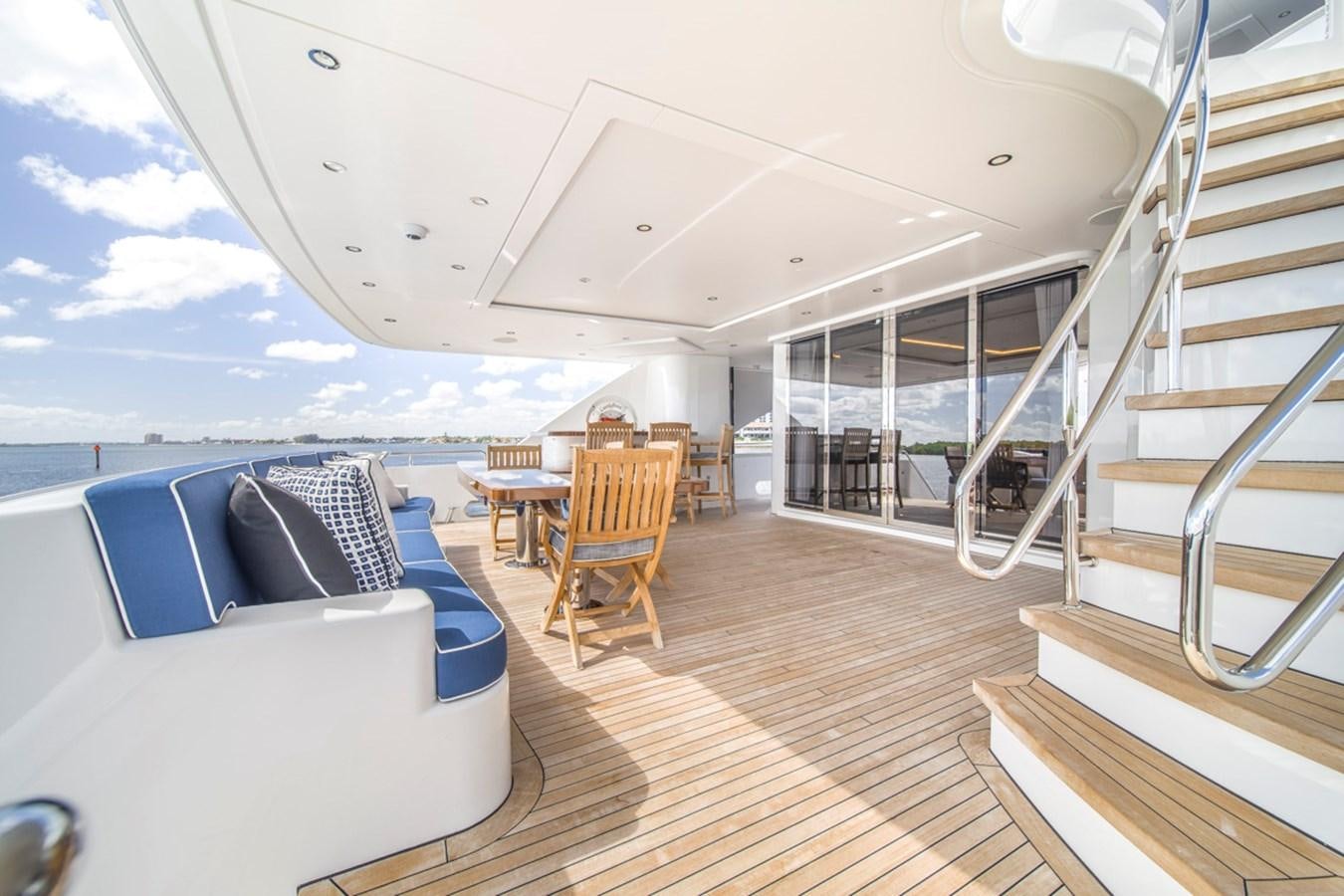 a large open space with a balcony aboard LION'S DEN Yacht for Sale