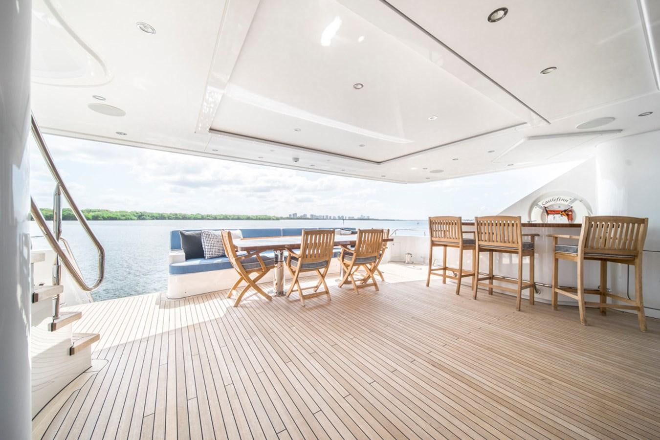 a room with a pool and a deck aboard LION'S DEN Yacht for Sale