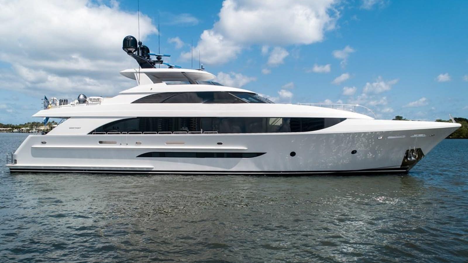 a white yacht on the water aboard Q Yacht for Sale