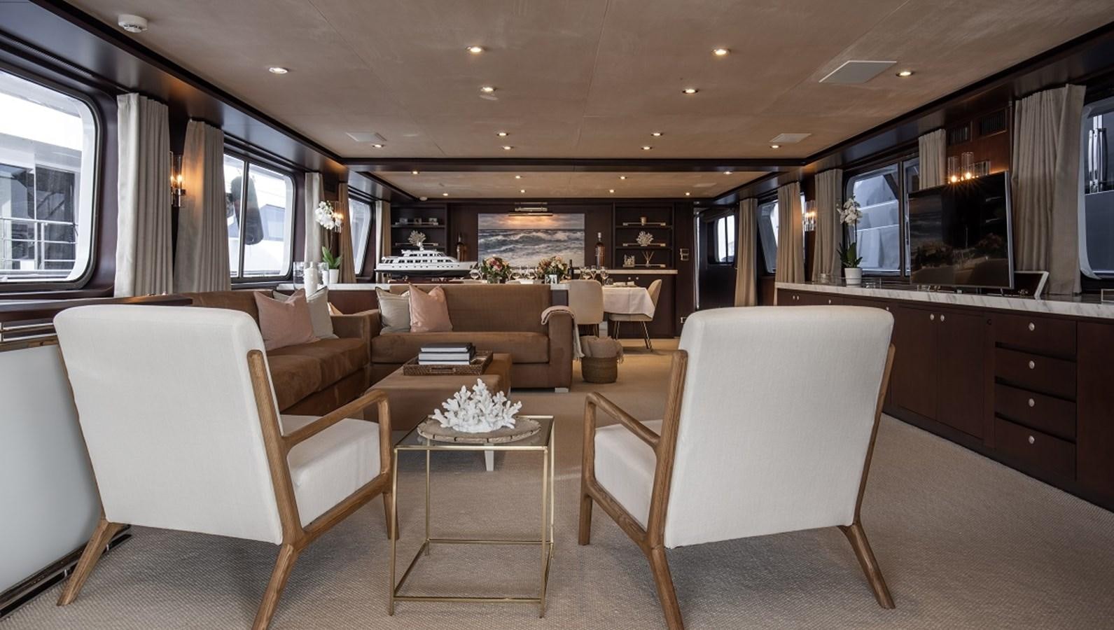 a living room with a couch and a table aboard CALLISTA Yacht for Sale