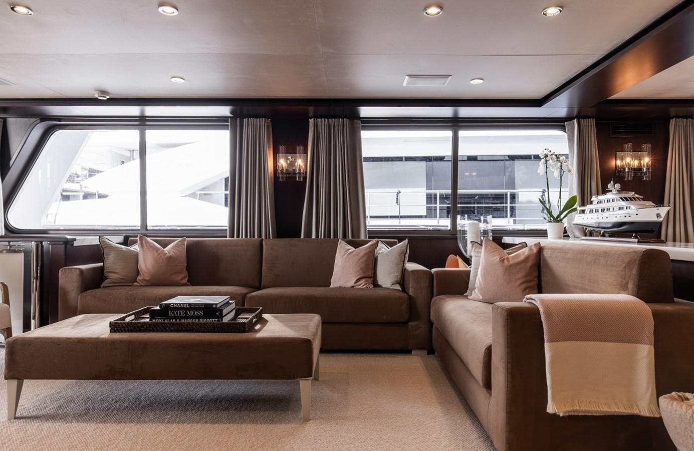 a living room with a large window aboard CALLISTA Yacht for Sale