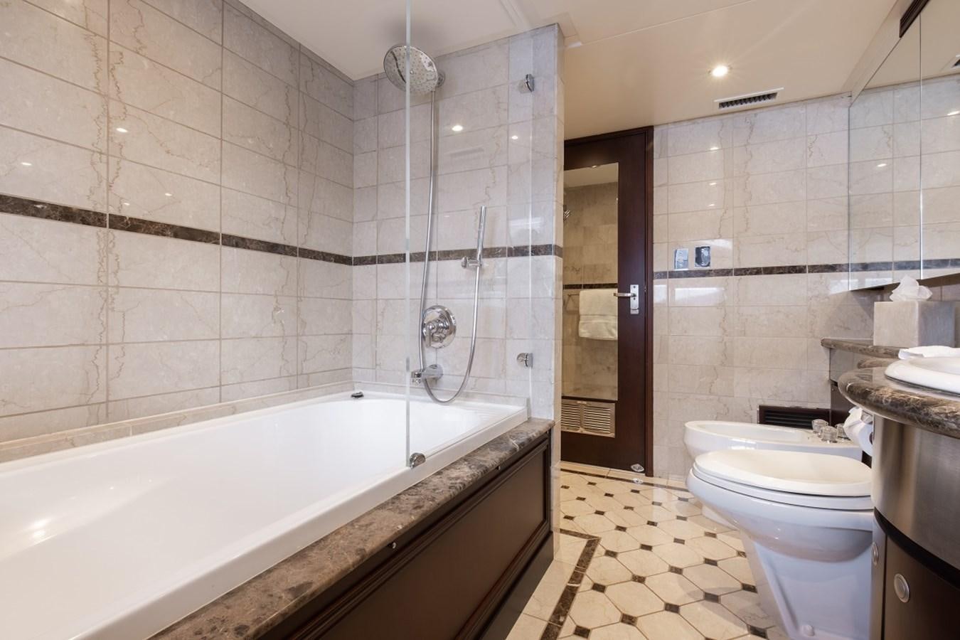 a bathroom with a bathtub toilet and sink aboard CALLISTA Yacht for Sale