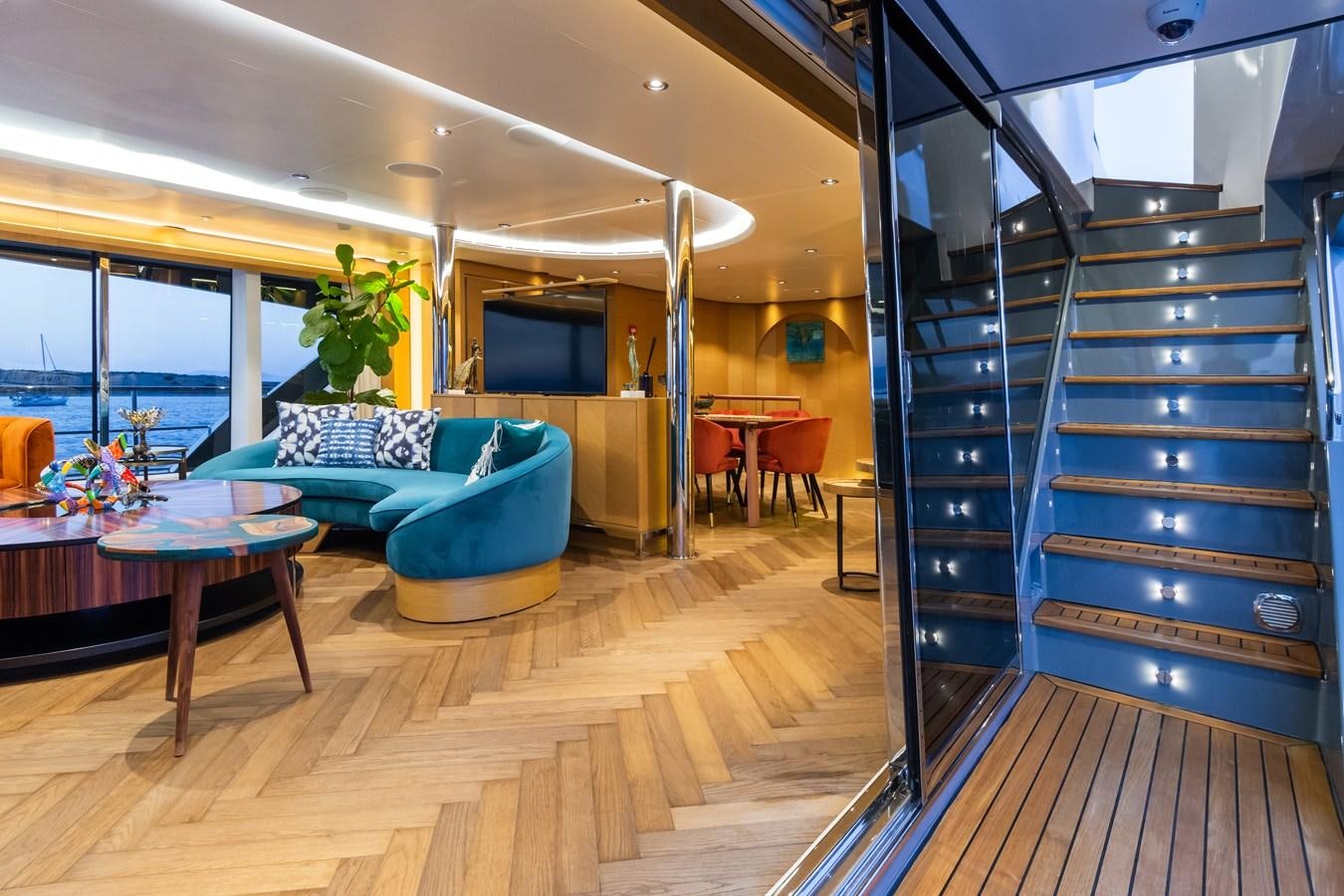 a living room with a staircase aboard LEONIDAS Yacht for Sale