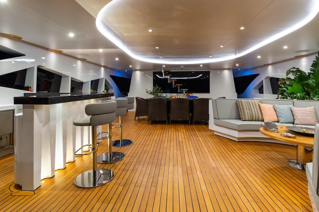 a room with a table chairs and a couch aboard LEONIDAS Yacht for Sale