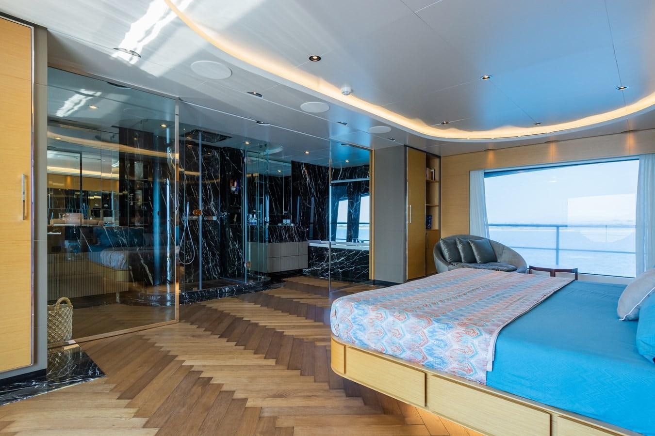 a room with a bed and a couch aboard LEONIDAS Yacht for Sale
