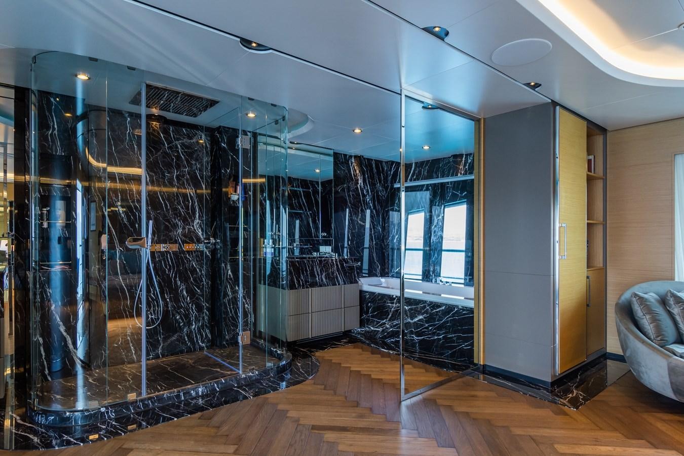 a large room with a glass wall aboard LEONIDAS Yacht for Sale