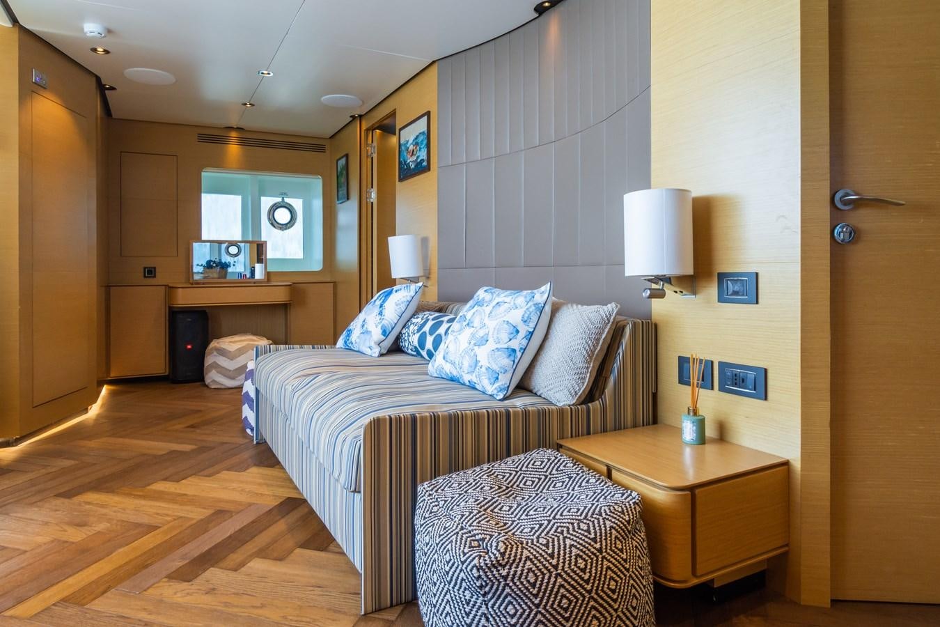 a bedroom with a bed and a desk aboard LEONIDAS Yacht for Sale