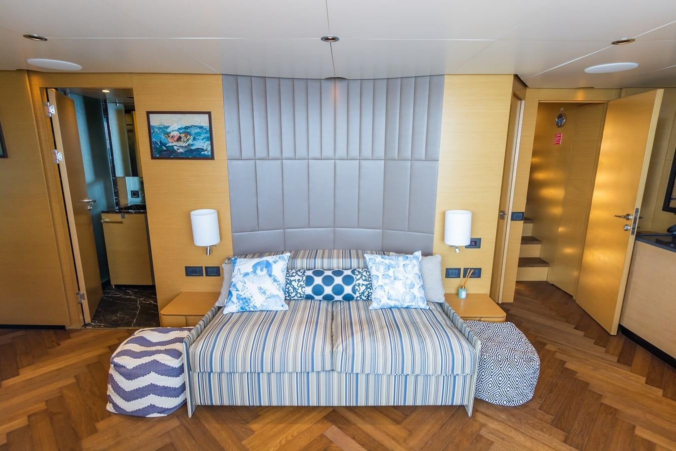 a bedroom with a bed and a door aboard LEONIDAS Yacht for Sale