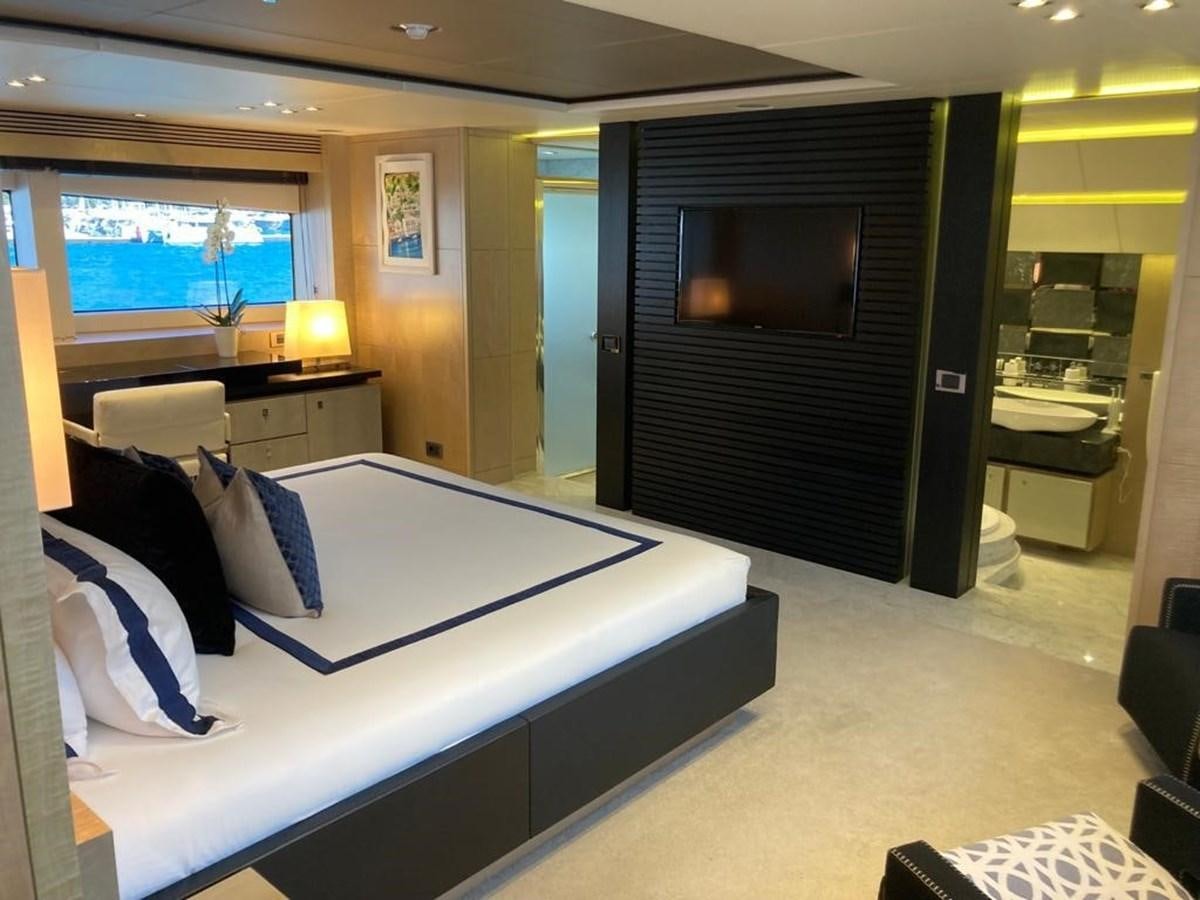 a hotel room with a bed aboard R2 Yacht for Sale