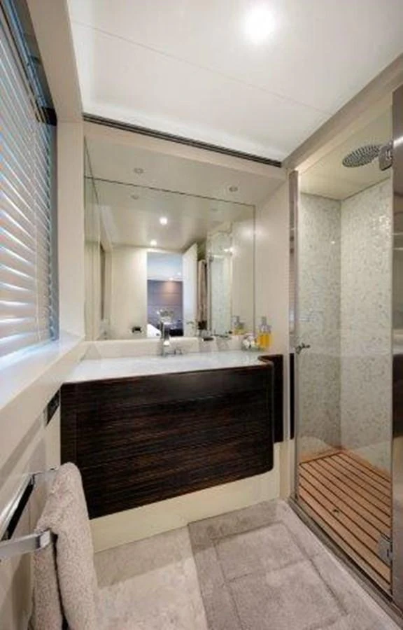 a bathroom with a tub and a sink aboard Y42 Yacht for Sale