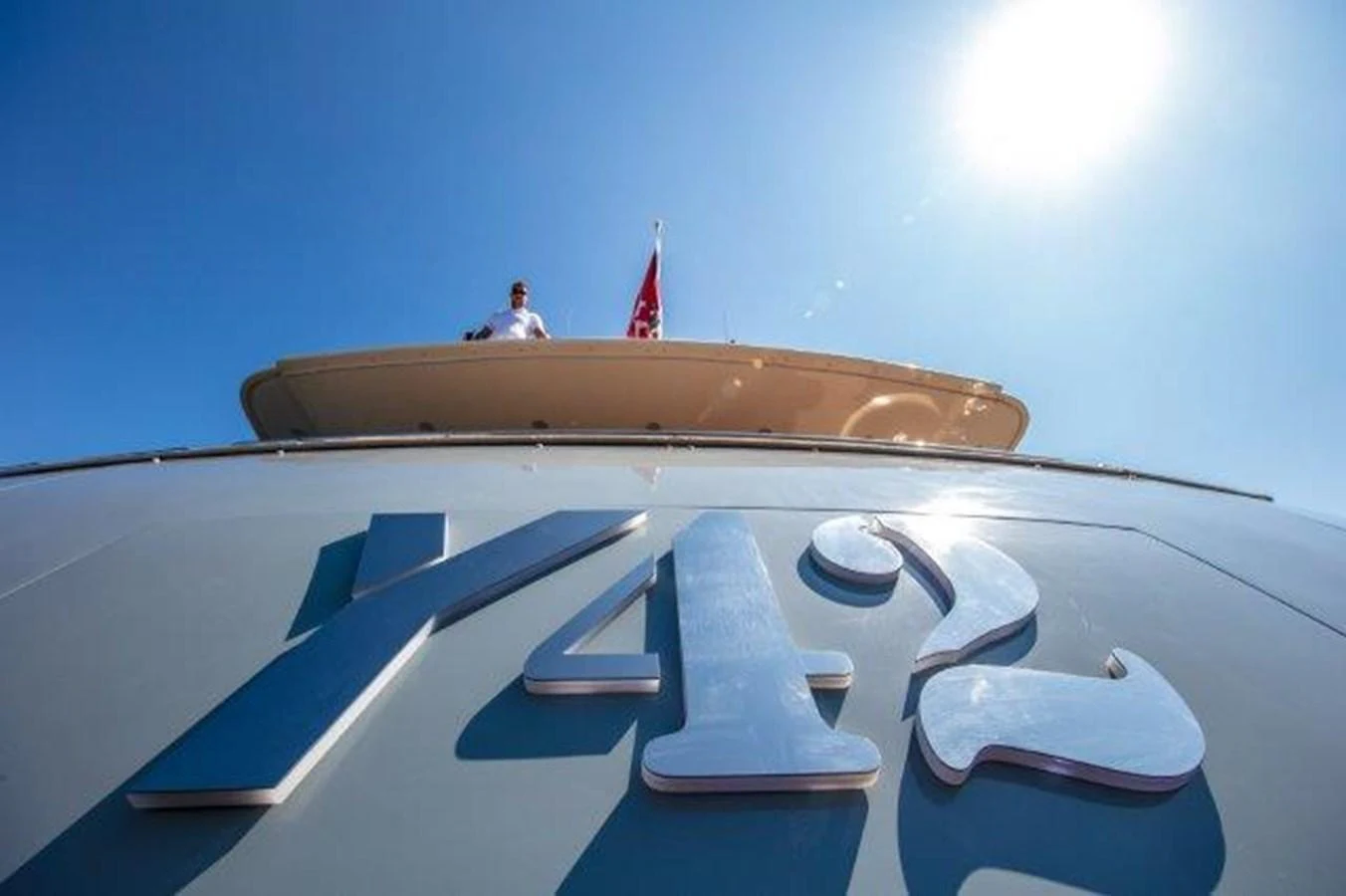 a person standing on a large boat aboard Y42 Yacht for Sale