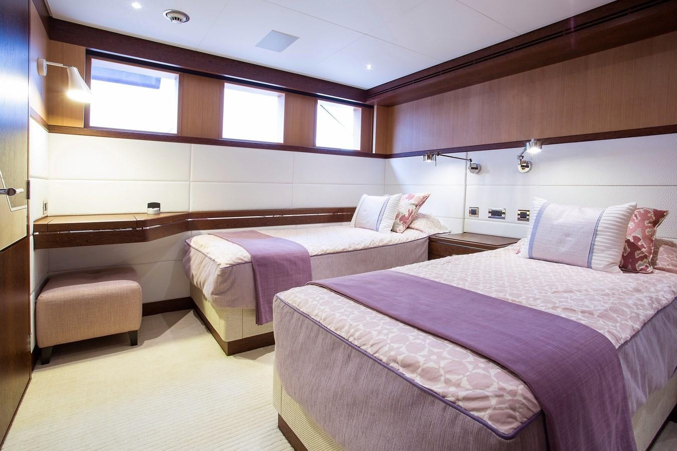 a room with three beds aboard GRAY CLIFFS Yacht for Sale
