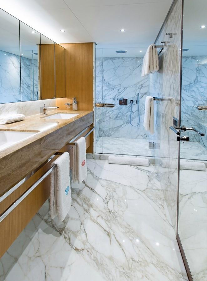 a bathroom with a shower and sink aboard GRAY CLIFFS Yacht for Sale
