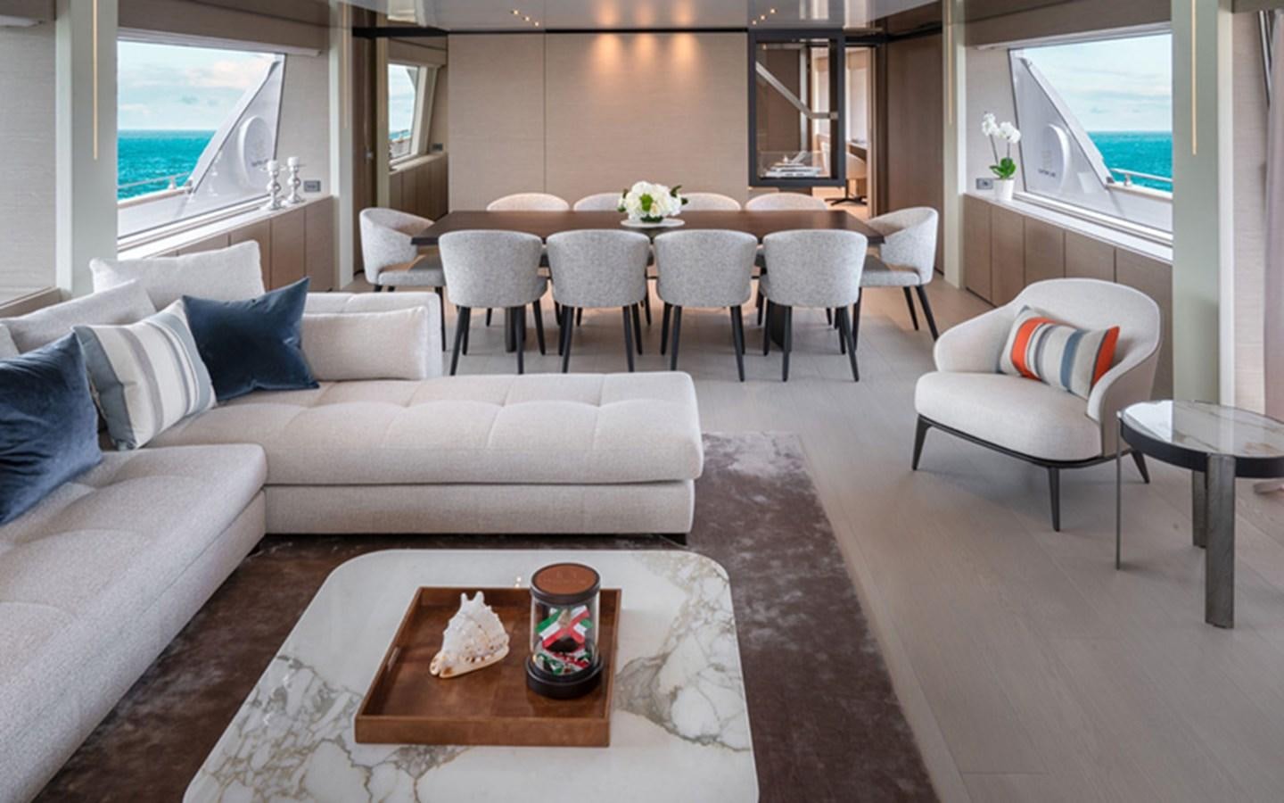a living room with a couch and a table aboard ADELIA Yacht for Sale