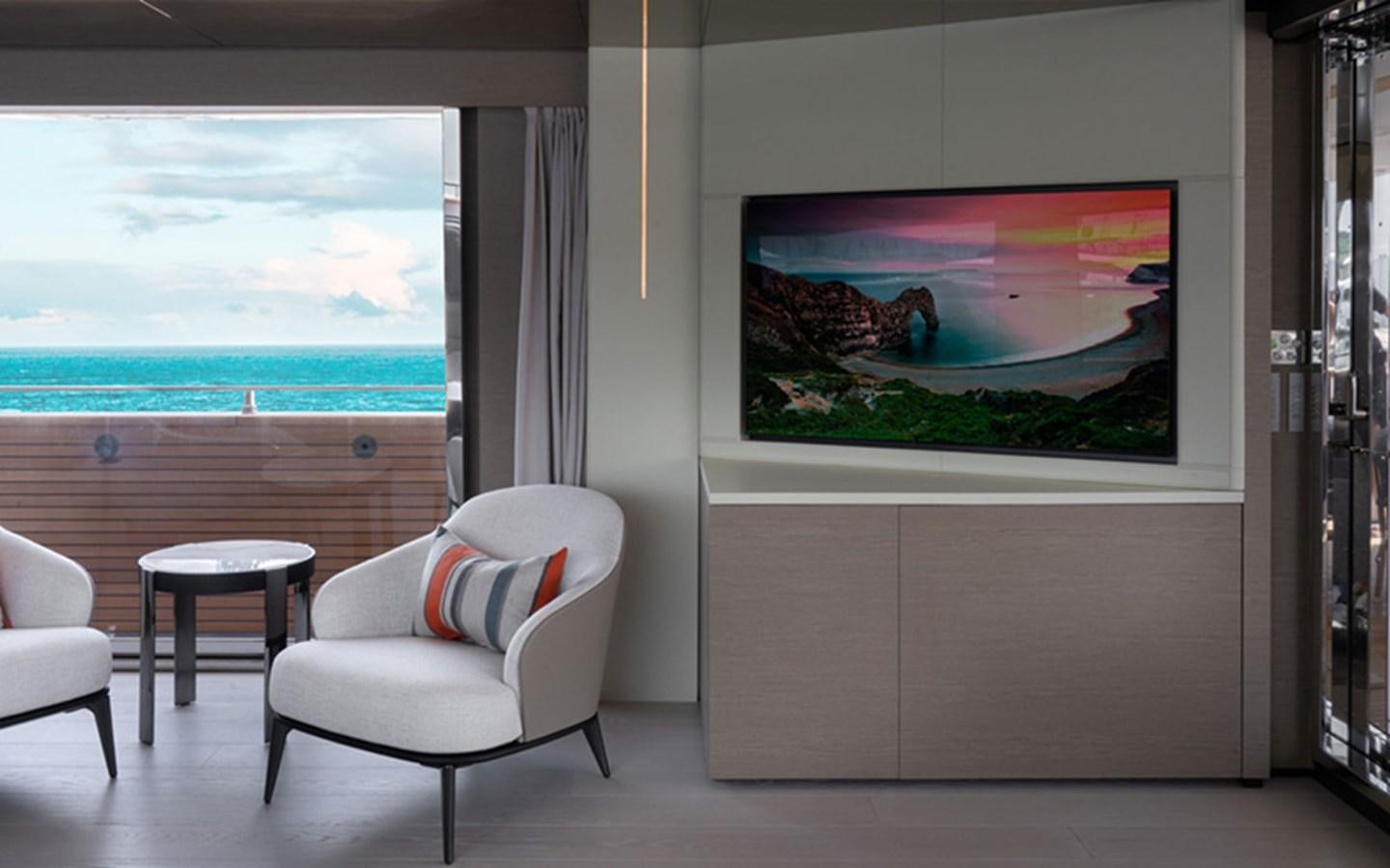 a living room with a large painting aboard ADELIA Yacht for Sale