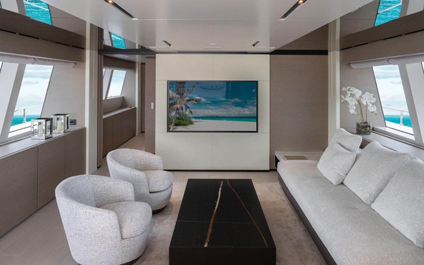 a room with couches and a tv aboard ADELIA Yacht for Sale
